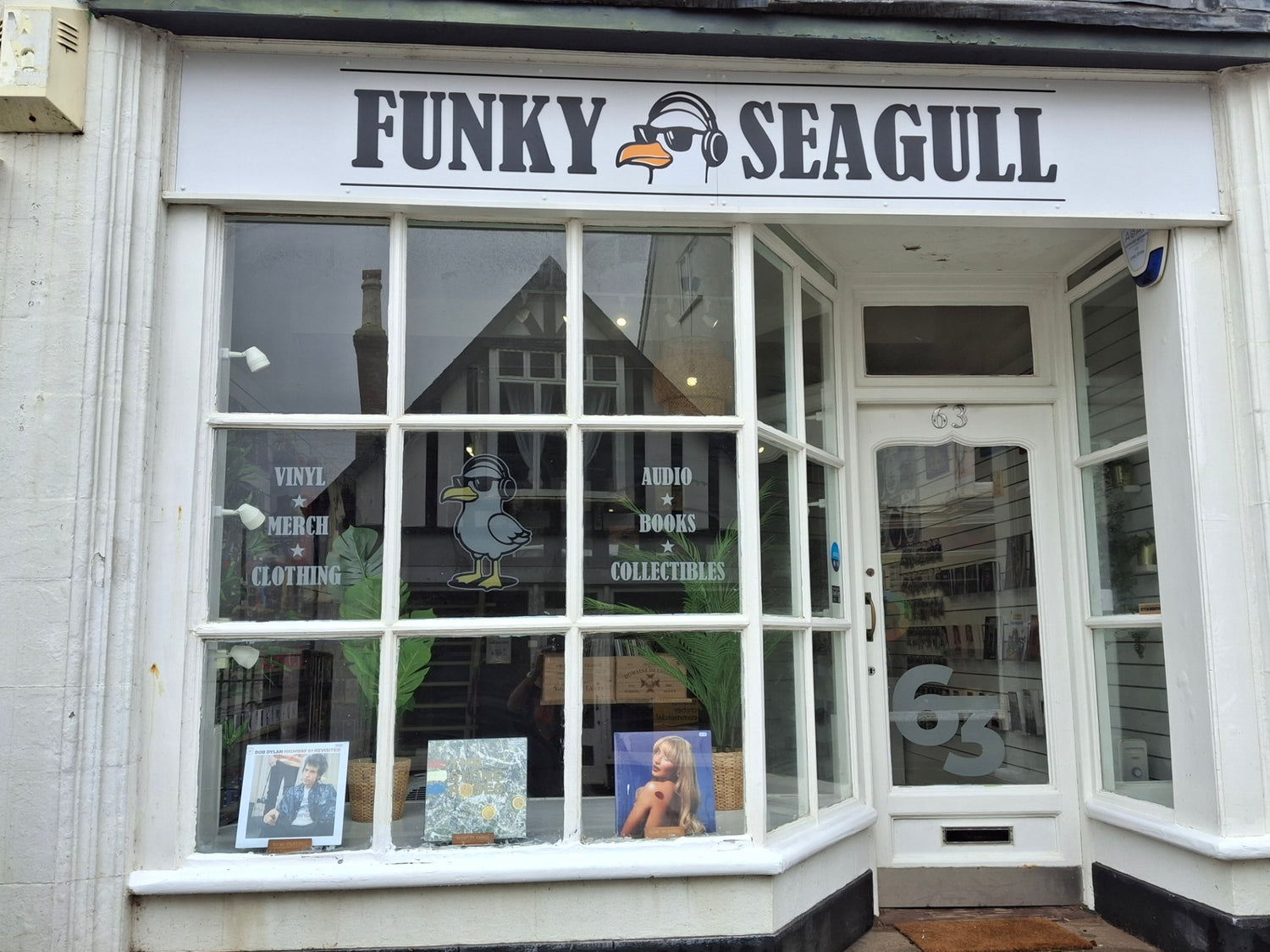 Storefront with 'Funky Seagull' sign above a window display.